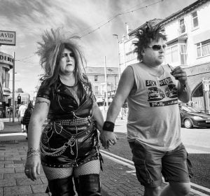 Street photography of couple walking.