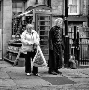 Street photography: Two people walking.